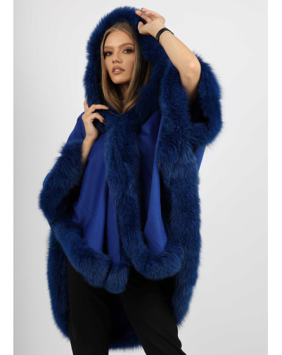 Model wearing Ophelia blue fox fur hooded cape, showcasing the full hood and lavish fur trim.