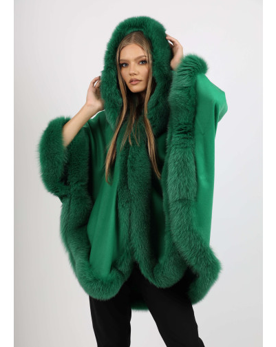 Model wearing Ophelia green fox fur hooded cape, showcasing the full hood and lavish fur trim.