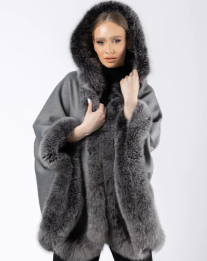 Model wearing Ophelia grey fox fur hooded cape, showcasing the full hood and lavish fur trim.