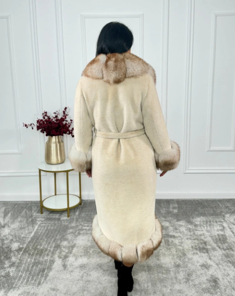 Back view of the Oya Alcantara coat, displaying the elegant flow and fox fur trim detailing along the hem and cuffs.